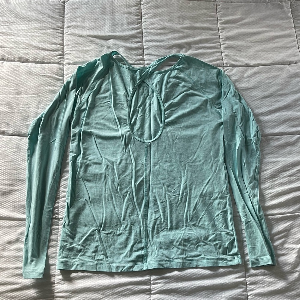 Aqua Under Armour long sleeve workout top with back cutout and thumb holes